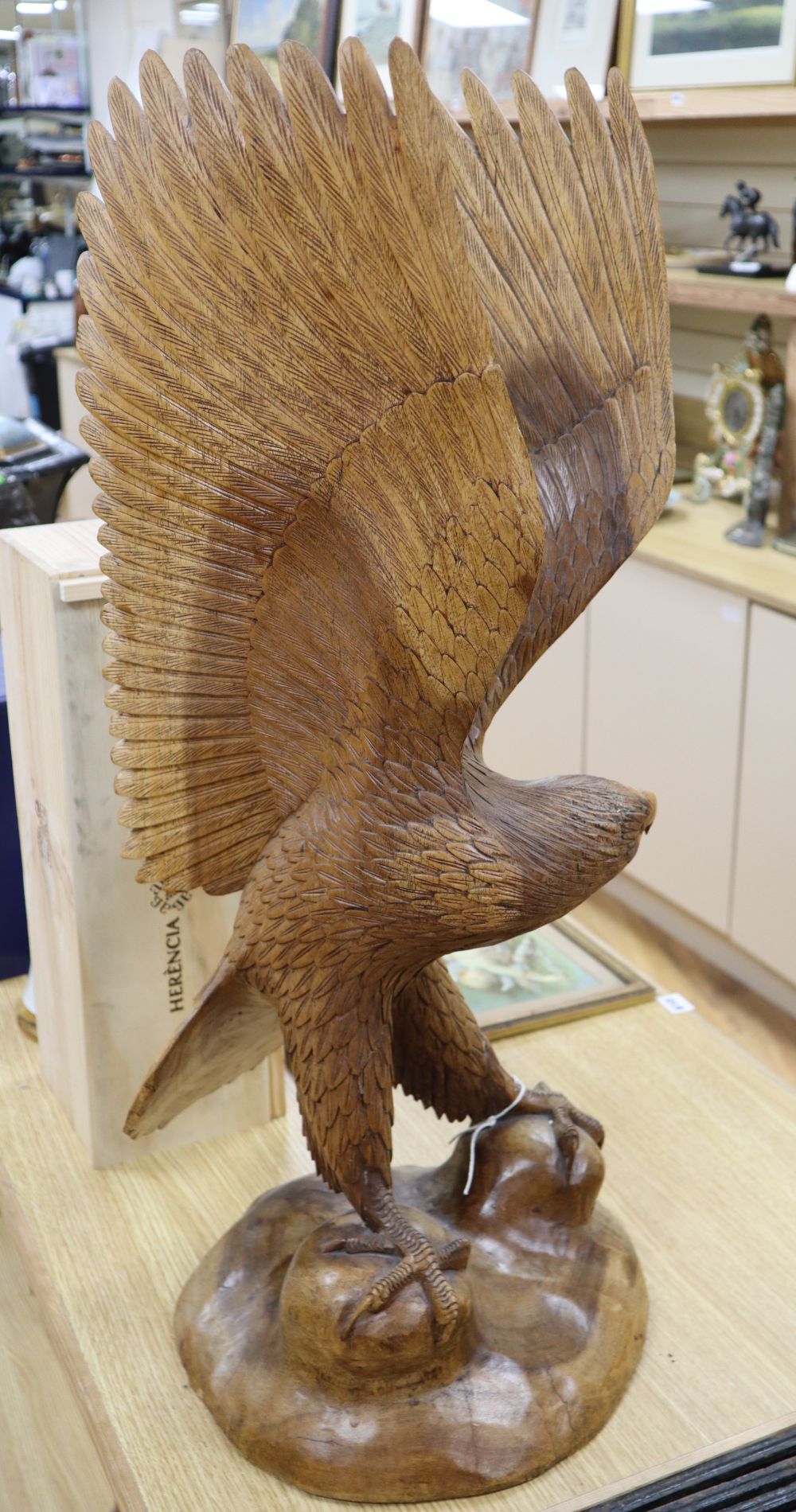 A contemporary carved wood model of a Golden Eagle